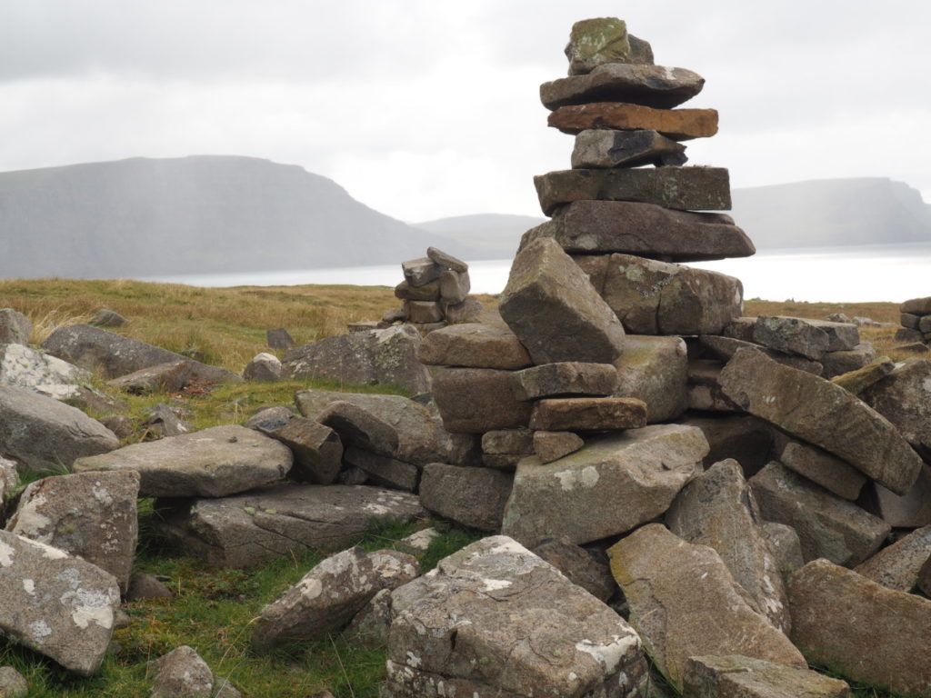 stone cairns neist point lighthouse isle of sky scotland field marsh